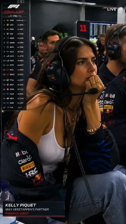 F1 live broadcast screenshot of a paddock guest watching the final lap